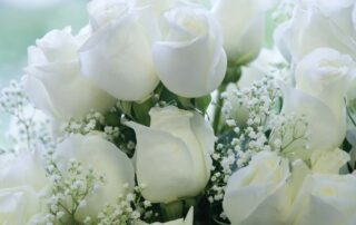 Flowers of Kingwood offers festive white roses for New Years